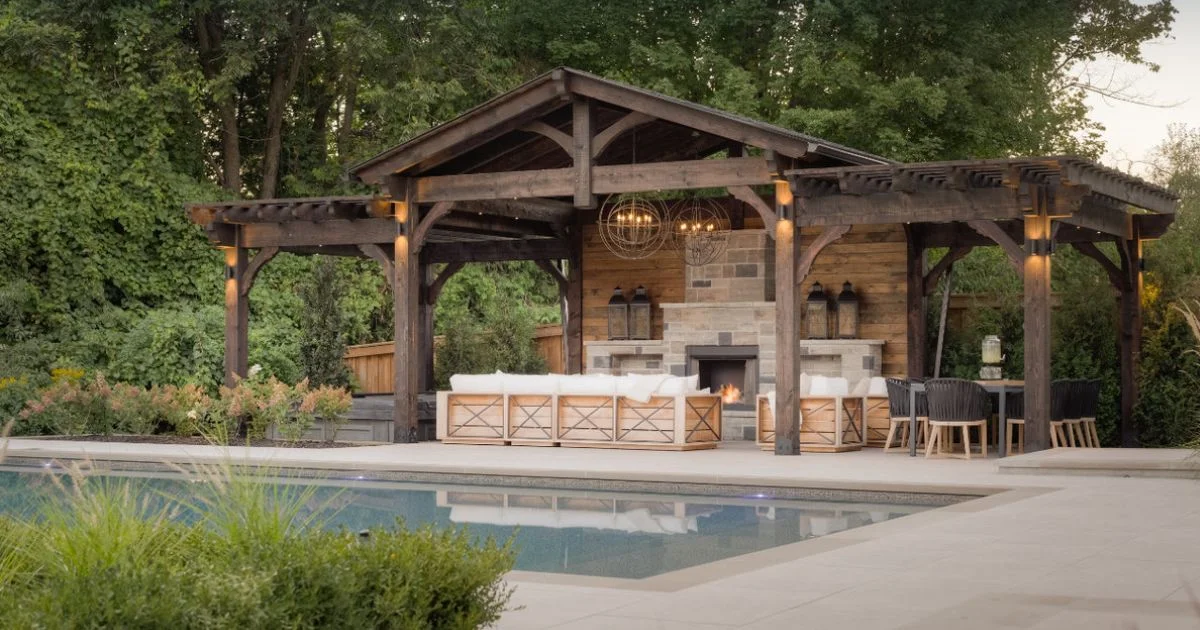Luxury timber poolside pavilion with outdoor fireplace