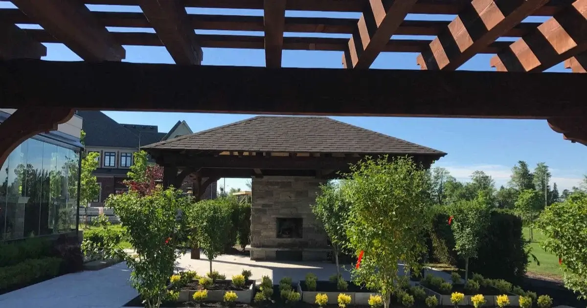 Pergola overlooking outdoor pavilion and landscaped garden