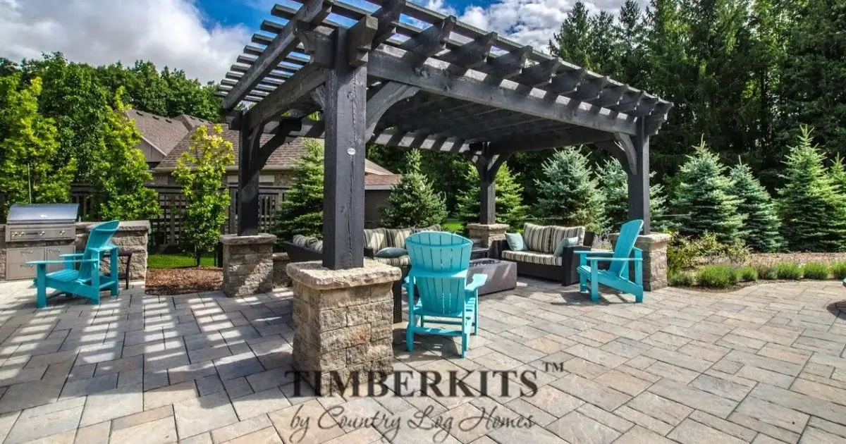 Backyard pergola patio with seating and grill